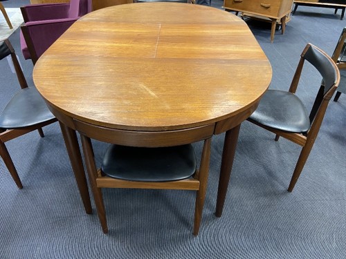 Lot 259 - Hans Olsen for Frem Rojle, a Danish teak dining table and four hideaway chairs, circa 1965