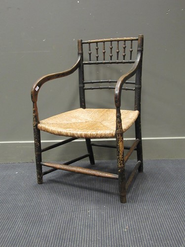 Lot 508 - A Regency faux bamboo ebonised elbow chair