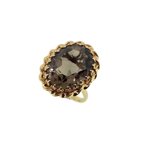 Lot 54 - A smokey quartz single stone ring