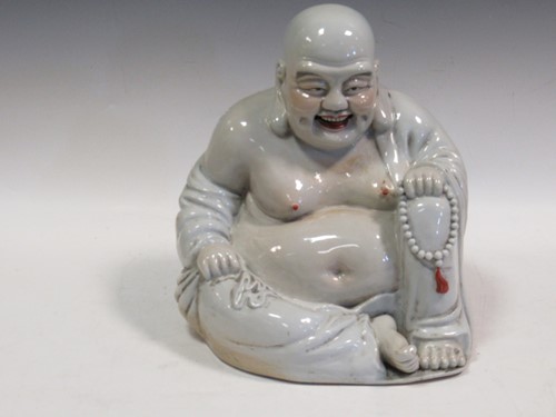 Lot 107 - A model Buddha, mid 20th century, white glazed,...