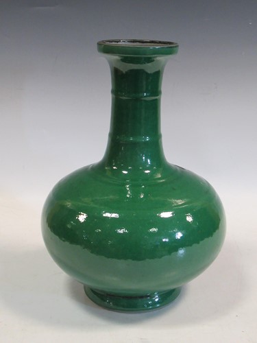 Lot 108 - Green glaze bottle vase, 2 neck rings, bulbous...