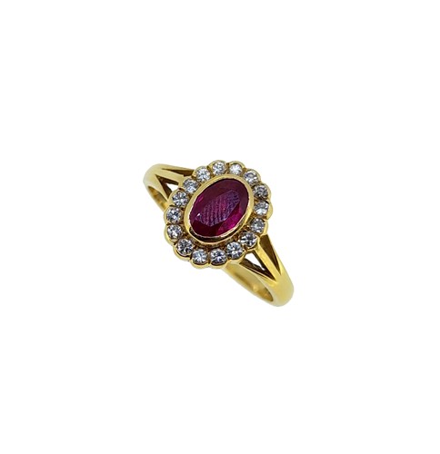 Lot 72 - An 18ct gold ruby and diamond cluster ring