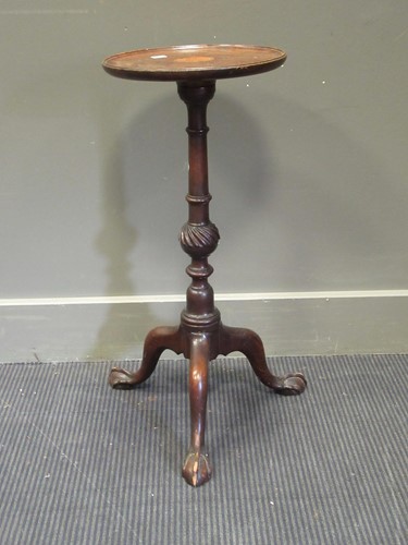 Lot 515 - A mahogany George III style wine tripod table...