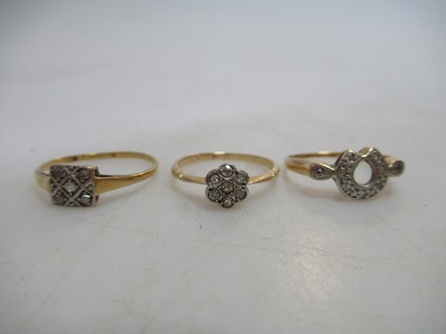 Lot 251 - Three diamond cluster rings, each tested as...