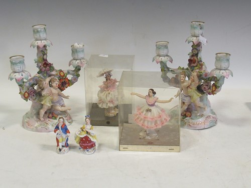 Lot 127 - A pair of German porcelain figural candelabra,...
