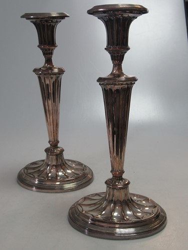 Lot 294 - A pair of silver plated copper candlesticks