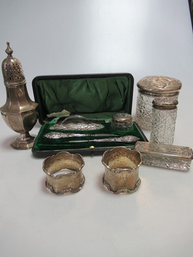Lot 293 - A silver sugar caster and two napkin rings...