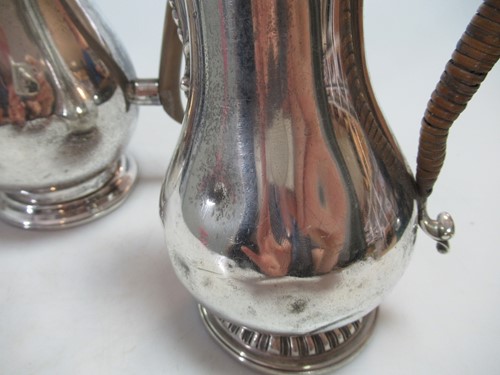 Lot 289 - Two silver hot water jugs, 25.7ozt gross (2)
