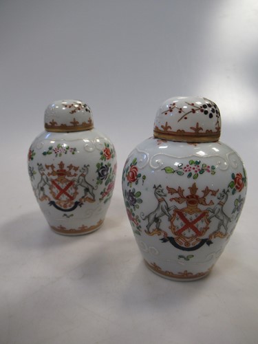 Lot 136 - A pair of Sampson armorial jars and covers