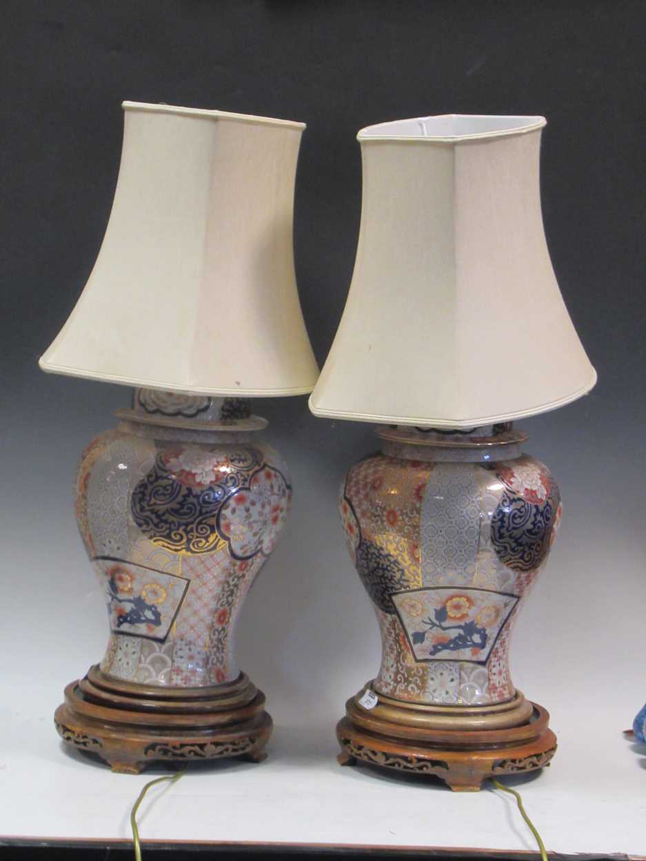 Lot 572 - A pair of Imari porcelain lamps and shades,...
