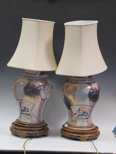 Lot 572 - A pair of Imari porcelain lamps and shades,...