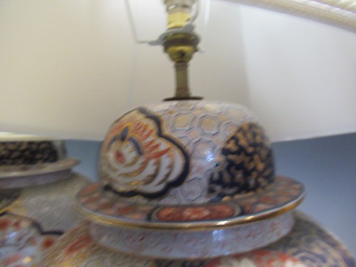 Lot 572 - A pair of Imari porcelain lamps and shades,...