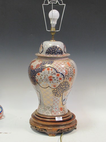 Lot 572 - A pair of Imari porcelain lamps and shades,...