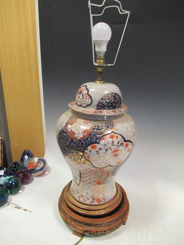 Lot 572 - A pair of Imari porcelain lamps and shades,...