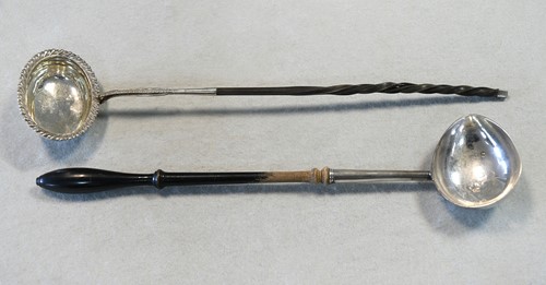 Lot 389 - A George II silver punch ladle together with a William IV example