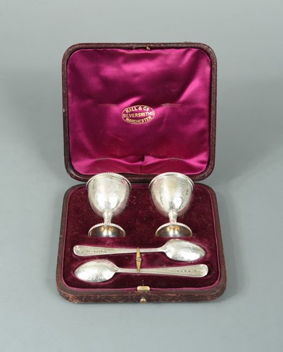 Lot 420 - A pair of Victorian silver egg cups with associated spoons