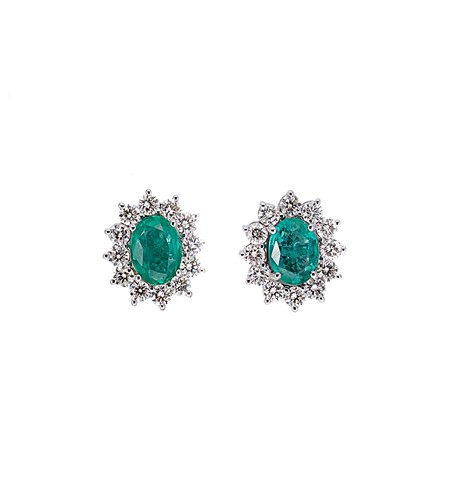 Lot 192 - A pair of emerald and diamond cluster ear studs