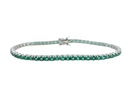 Lot 104 - An emerald line bracelet set in 18ct white gold