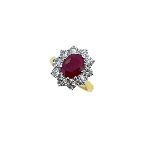 Lot 198 - A ruby and diamond cluster ring