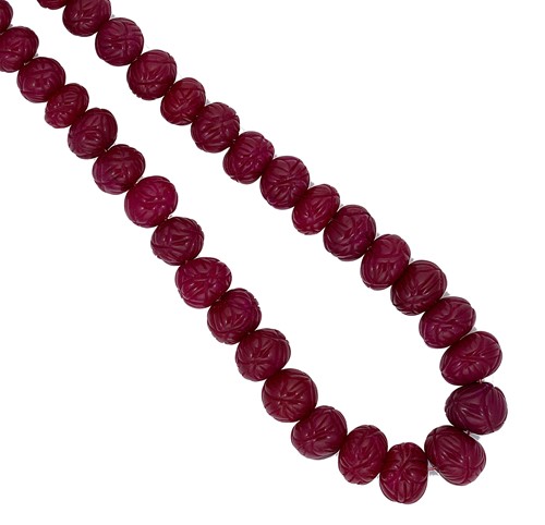 Lot 66 - A  necklace of carved ruby beads