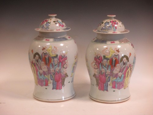 Lot 119 - A pair of Chinese baluster vases and covers,...