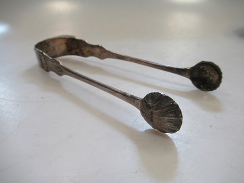 Lot 300 - A pair of Glasgow silver sugar nips