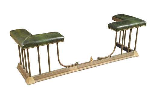 Lot 277 - A brass and leather adjustable club fender, early 20th century