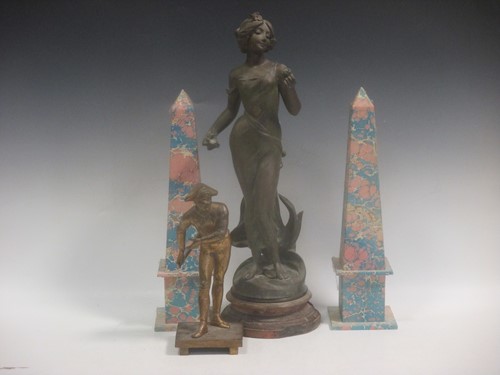 Lot 118 - A gilt metal figure of Harlequin, a patinated...