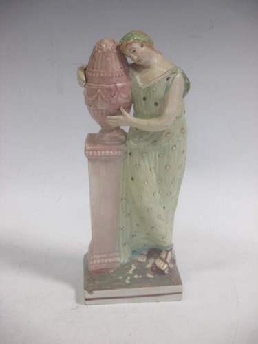 Lot 109 - A pearlware figure of a Classical maiden 24cm...