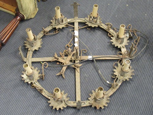 Lot 558 - A wrought iron chandelier of spoke design 65cm...
