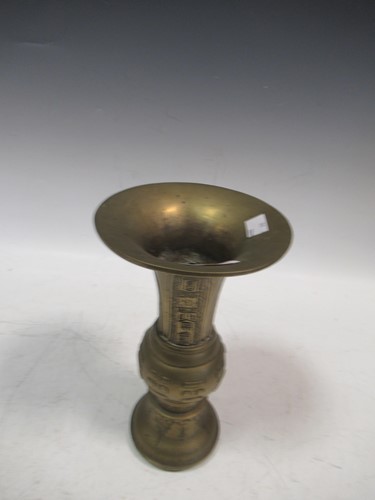 Lot 24 - A Chinese brass or bronze Gu shape vase