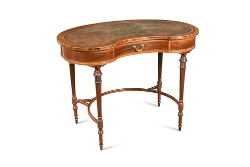 Lot 485 - An Edwardian mahogany cross banded kidney shaped writing table
