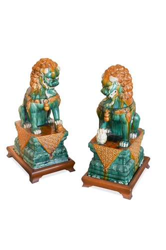 Lot 107 - A Pair of Chinese Tang Style pottery fo-dogs, 20th century