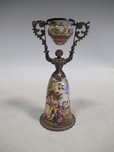 Lot 171 - A Continental painted enamel female form wager...