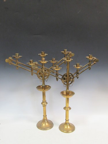 Lot 123 - A pair of brass ecclesiastical candelabrum in...
