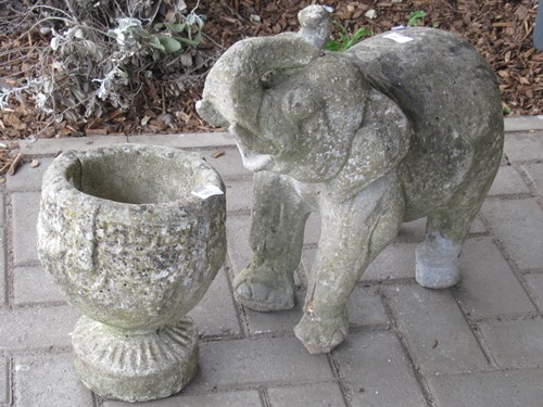 Lot 583 - A composite garden elephant together with a...