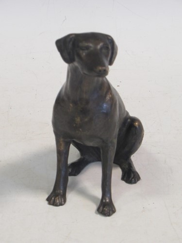 Lot 132 - A bronze model of a seated dog 14.5cm high