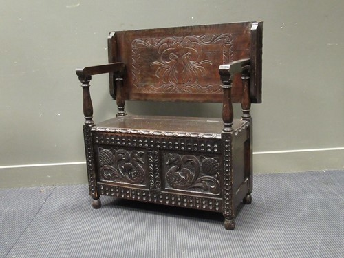 Lot 524 - A carved oak monk's bench, 80 x 92 x 42cm