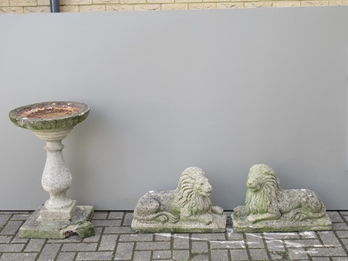 Lot 575 - A small pair of composite garden lions and a...