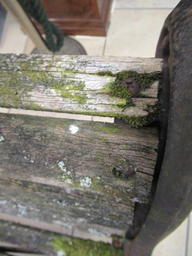 Lot 576 - Two cast iron frame garden benches and a table....