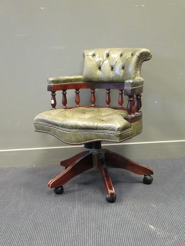 Lot 449 - A George Smith captain's chair with green...