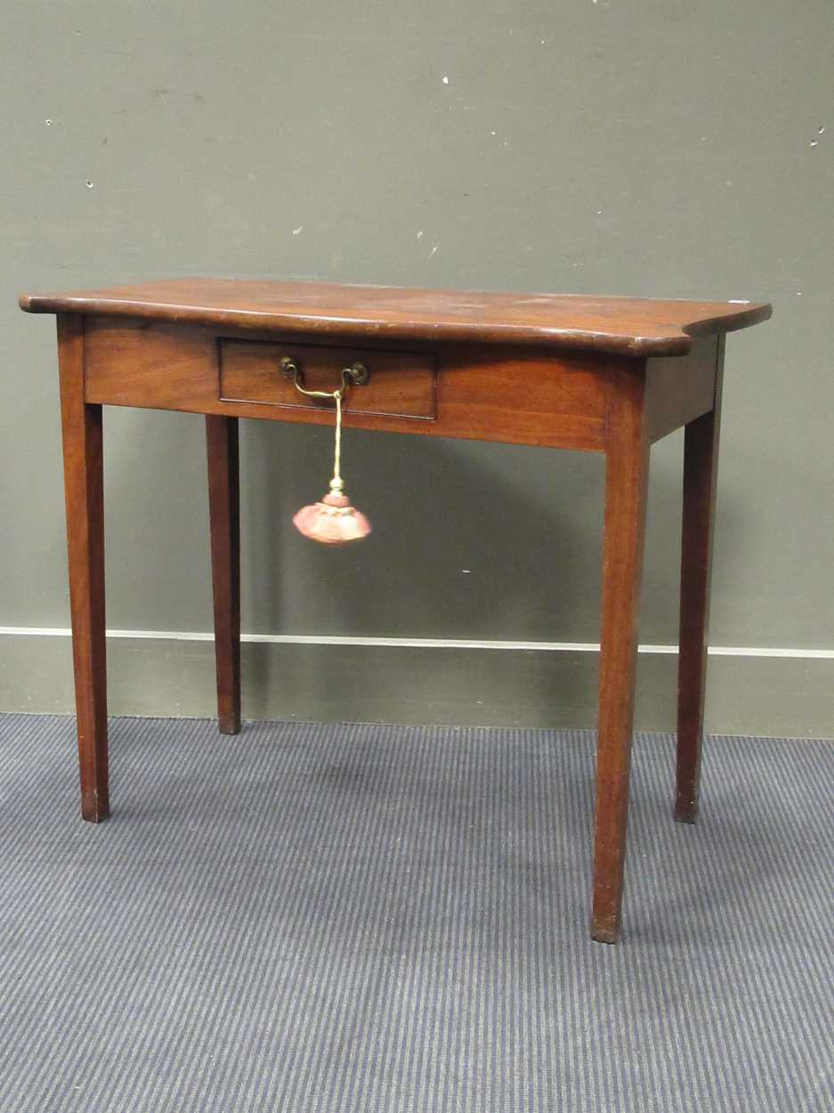 Lot 476 - A mahogany serpentine shape side table with...