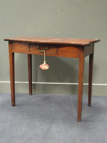 Lot 476 - A mahogany serpentine shape side table with...