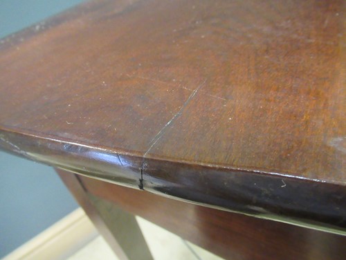 Lot 476 - A mahogany serpentine shape side table with...