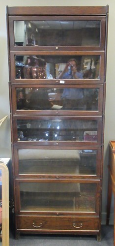 Lot 461 - A 20th century oak sectional bookcase with...