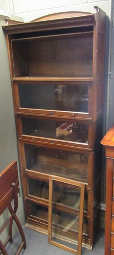 Lot 466 - Two 20th century oak Lebus sectional bookcases,...
