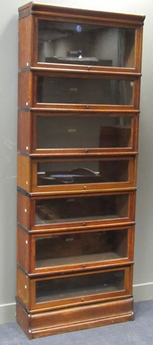 Lot 465 - A Globe Wernicke oak seven section bookcase...