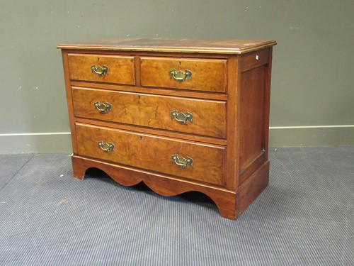 Lot 497 - A walnut chest of two short and two long...