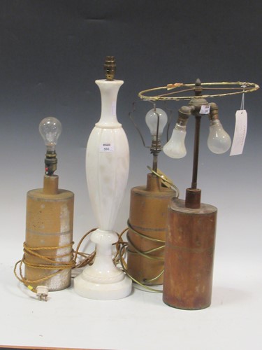 Lot 566 - A pair of tooled leather lamp bases (a/f)...