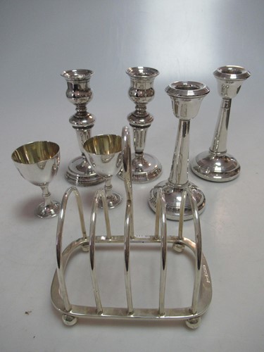 Lot 286 - A pair of silver egg cups and a silver toast...